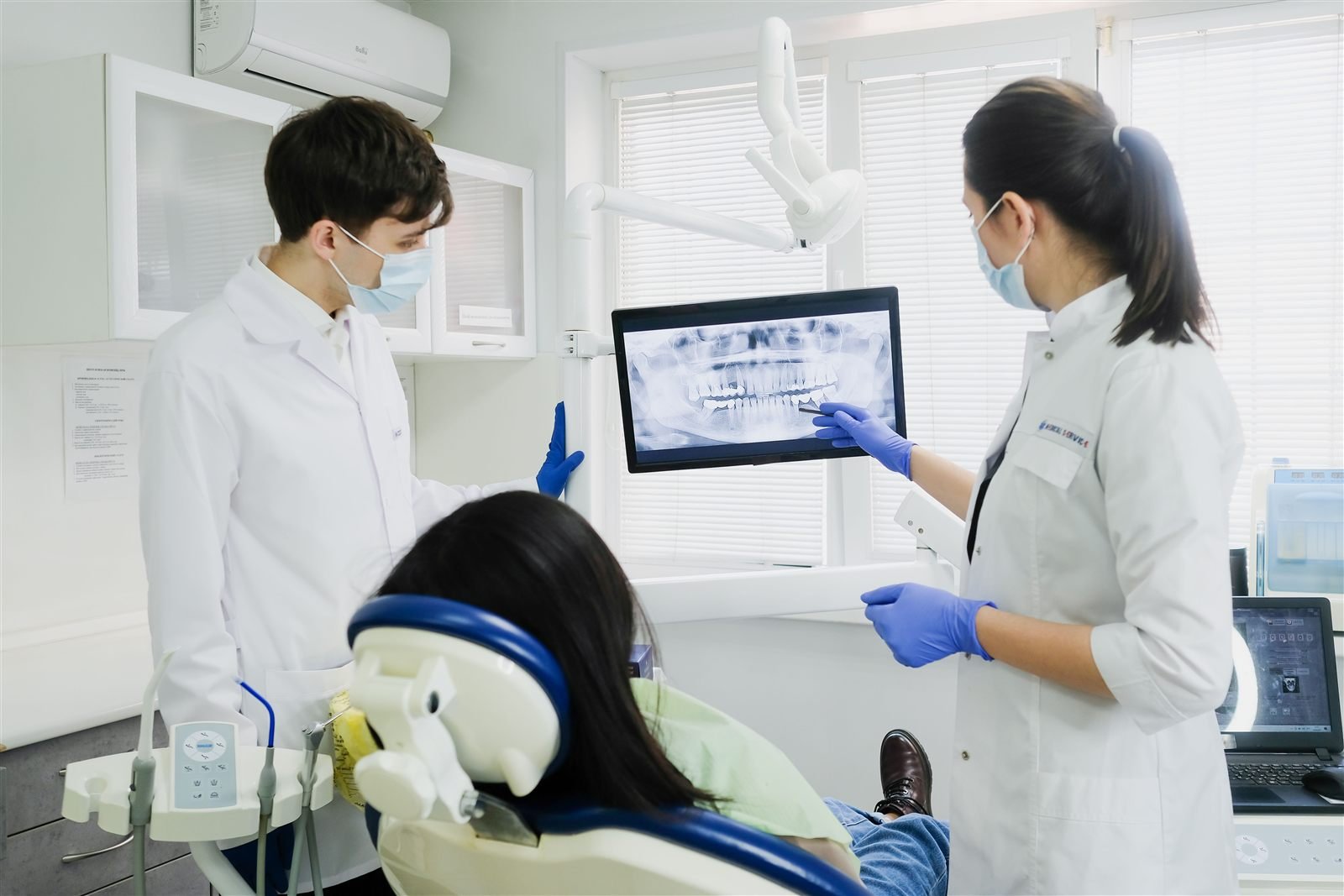 Dentist reviewing digital dental imaging with a patient